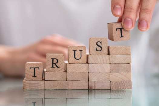 wooden blocks with letters TRUST written on them