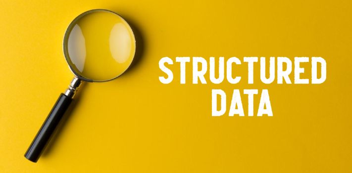 Structured Data written on a yellow background and a magnifying glass